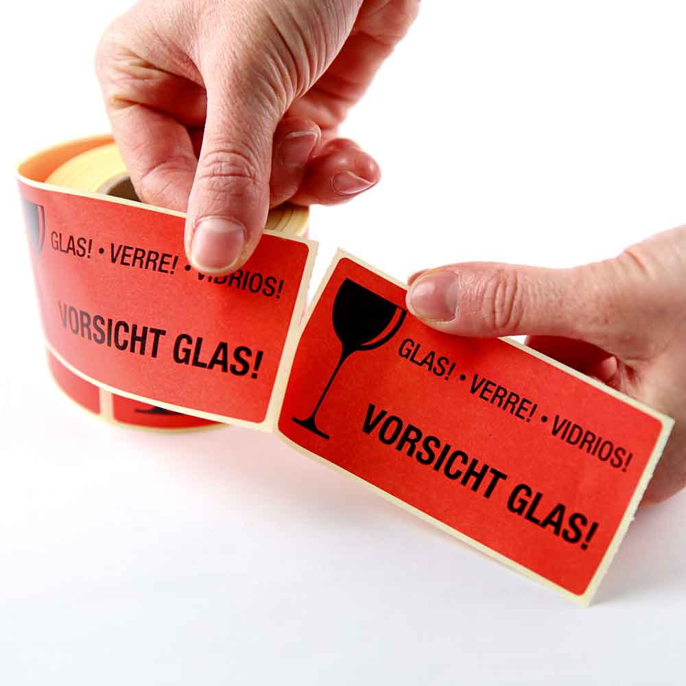 Warn- bzw. Verpackungsetiketten - selbstklebend in Signalrot auf Rolle Warn- bzw. Verpackungsetiketten - selbstklebend in Signalrot auf Rolle